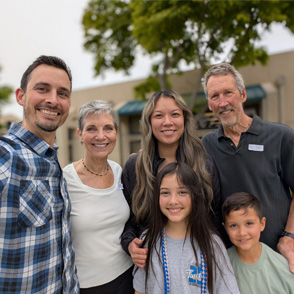 The Wilson family, owners of All Good Eats & Drinks, posing together inside their Thousand Oaks restaurant.