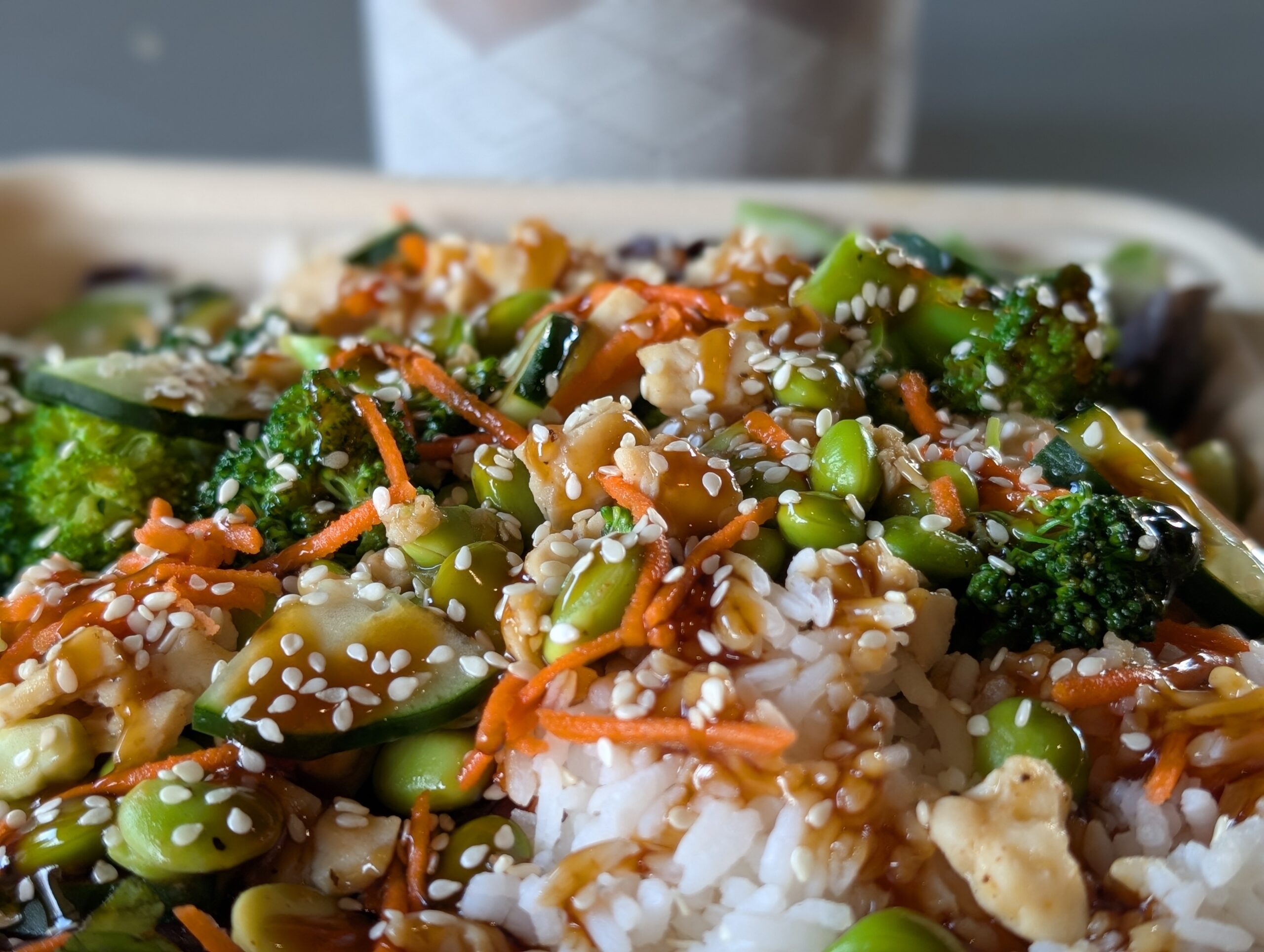 All Good Mezze plate with chicken shawarma, red quinoa, hummus, and pita bread.
